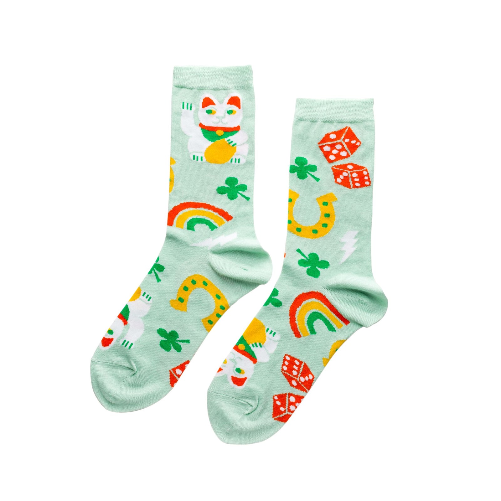 Mint green crew socks featuring maneki neko lucky cat horseshoes clovers rainbows and dice by Yellow Owl Workshop
