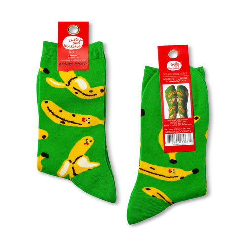Green socks with banana pattern on a white background