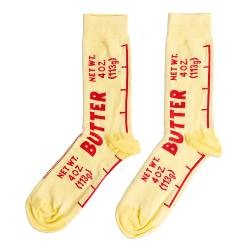 Yellow crew socks designed to look like a butter wrapper with bold red Butter label and Net Wt 4 oz text by Yellow Owl Workshop
