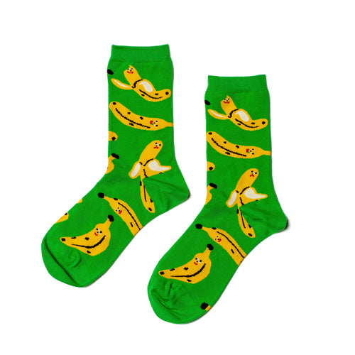 Green socks with banana pattern on a white background
