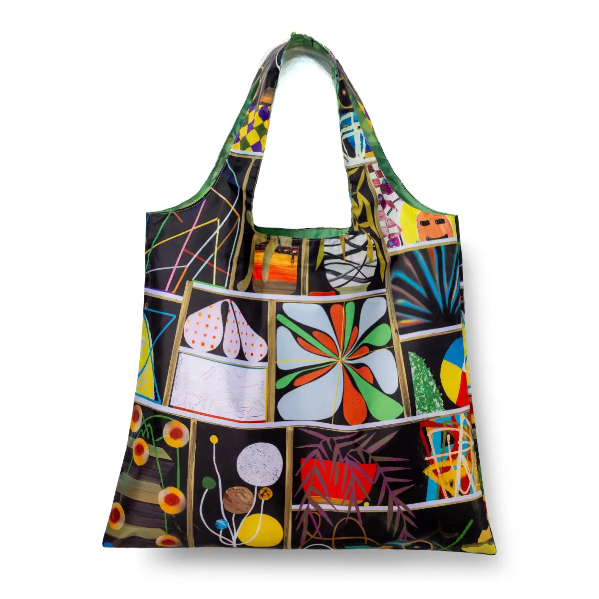 Illustrated reusable tote bag featuring bold collage panels with abstract florals starbursts and geometric forms on dark background by Paul Wackers for Yellow Owl Workshop