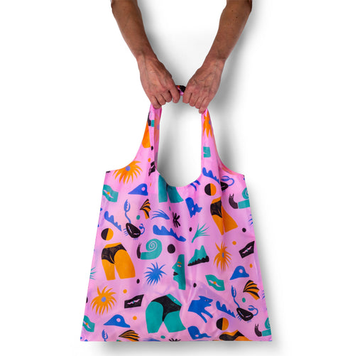 Person holding pink illustrated funny tote bag with cheeky abstract body print by Meg Fransee for Yellow Owl Workshop