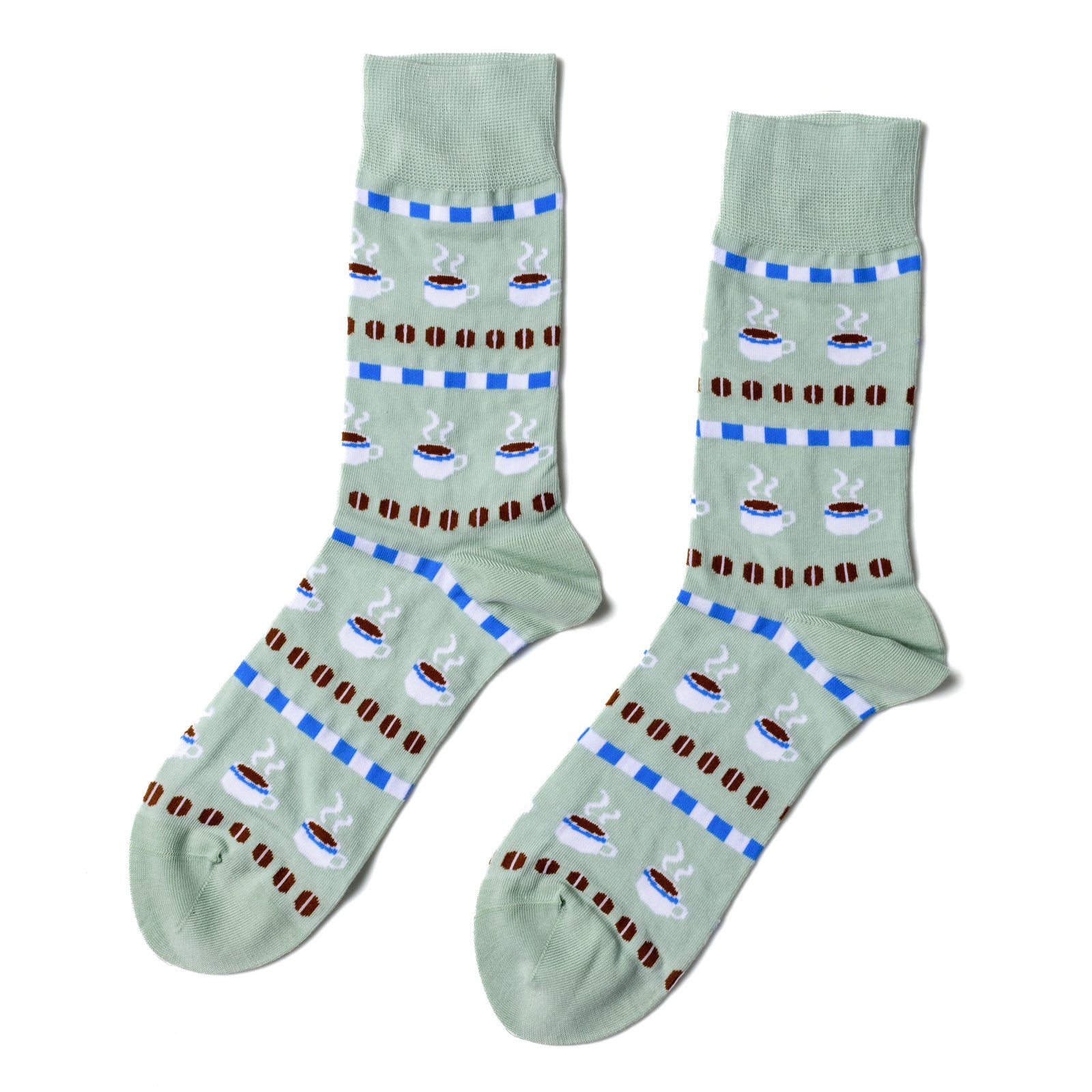 Sage green crew socks featuring illustrated steaming coffee cups and roasted beans in cross-stitch inspired pattern by Yellow Owl Workshop