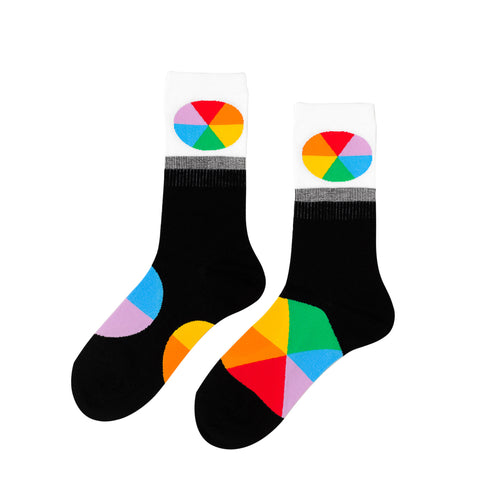 Black and white crew socks featuring bold multicolor color wheel on cuff and sole by Yellow Owl Workshop