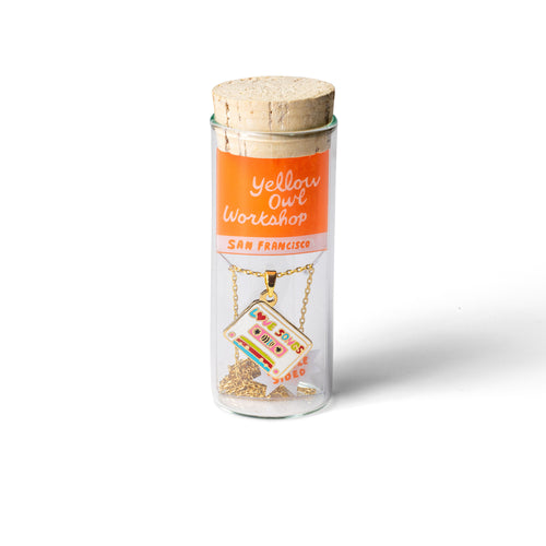 Cool Jams and Love Songs double-sided enamel pendant necklace in glass vial cork packaging by Yellow Owl Workshop