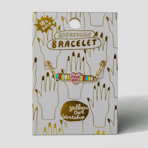 Pink enamel Fuck Off candy heart bracelet on gold foil packaging card by Yellow Owl Workshop