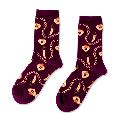 Burgundy crew socks featuring heart dagger all-seeing eye and gold chain illustrations in traditional tattoo style by Yellow Owl Workshop