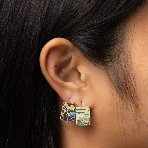 Impressionist mismatched enamel drop earrings worn on ear by Yellow Owl Workshop