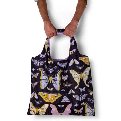 Person holding illustrated moth tote bag with moody detailed nocturnal moth print by Banquet Workshop for Yellow Owl Workshop