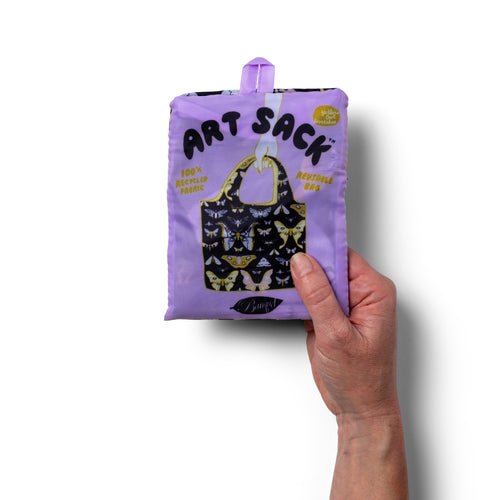 Person holding illustrated moth tote bag with moody detailed nocturnal moth print by Banquet Workshop for Yellow Owl Workshop