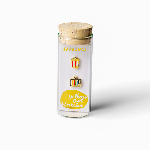 Movie night mismatched cloisonné stud earrings in glass vial packaging by Yellow Owl Workshop
