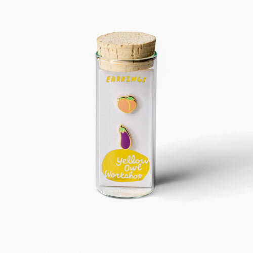 Peach and eggplant mismatched cloisonné stud earrings in glass vial packaging by Yellow Owl Workshop