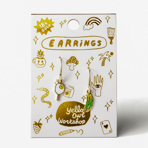 Pickleball mismatched enamel drop earrings on gold foil matchbook card by Yellow Owl Workshop