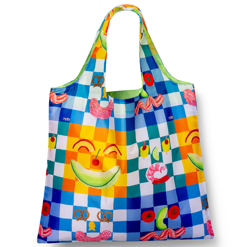 Illustrated reusable tote bag featuring playful colorful picnic food illustrations by Kristina Micotti for Yellow Owl Workshop
