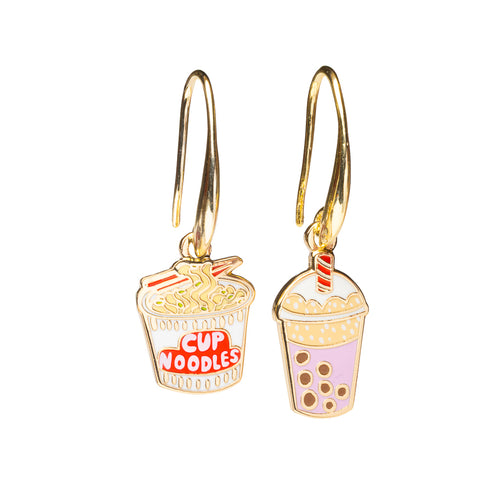 Mismatched enamel drop earrings featuring cup noodles and lavender boba drink with tapioca pearls by Yellow Owl Workshop