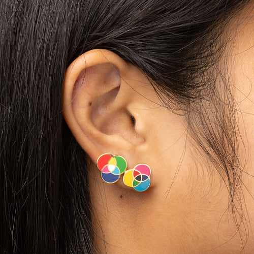 RGB and CMYK mismatched gold stud earrings worn on ear by Yellow Owl Workshop
