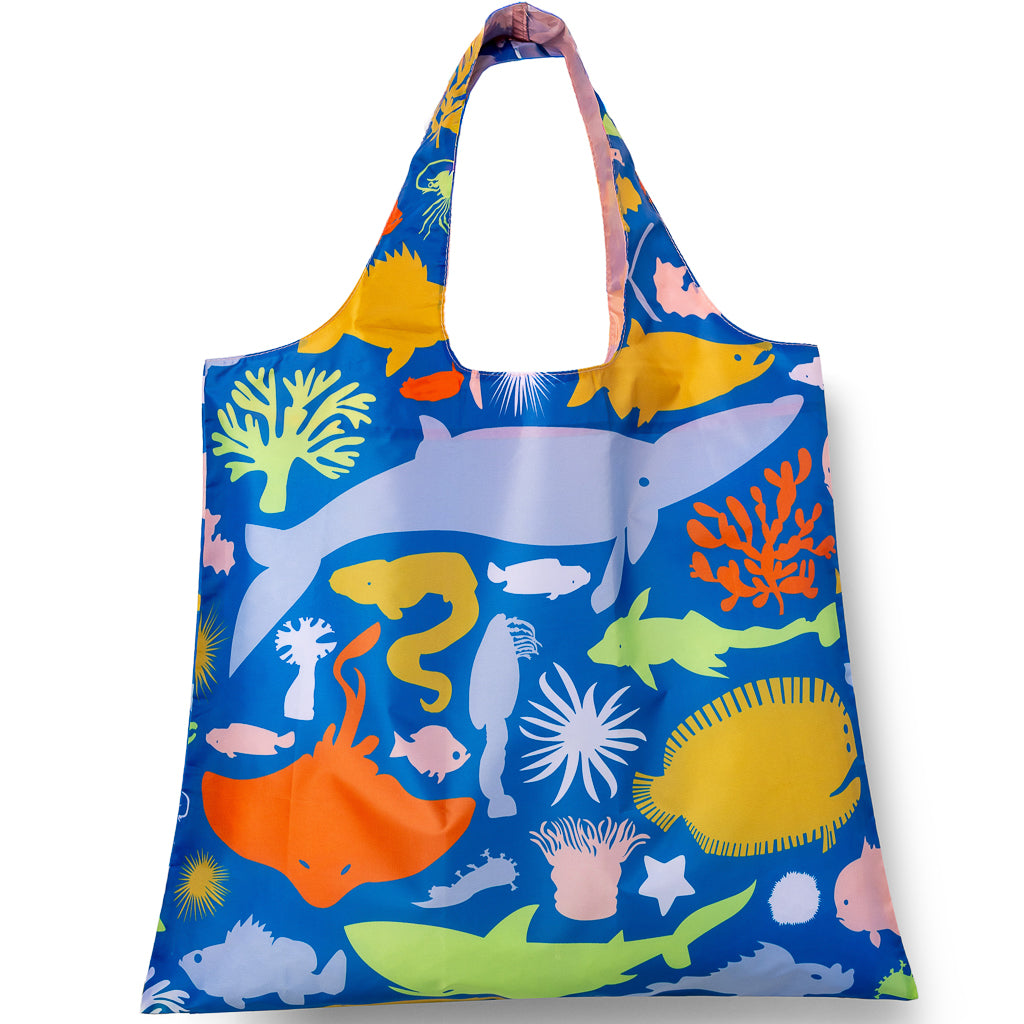 Blue illustrated reusable tote bag featuring detailed sea life including whales and anemones by Banquet Workshop for Yellow Owl Workshop