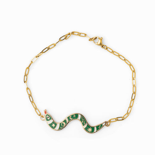 Green and white enamel snake charm bracelet with stars and moons detail on gold paperclip chain by Yellow Owl Workshop