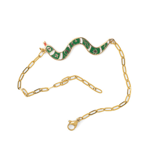 Green and white enamel snake charm bracelet with stars and moons detail unclasped on white background by Yellow Owl Workshop