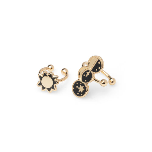 Mismatched gold sun and moon phases no-piercing ear cuffs featuring sun and half crescent and new moon by Yellow Owl Workshop