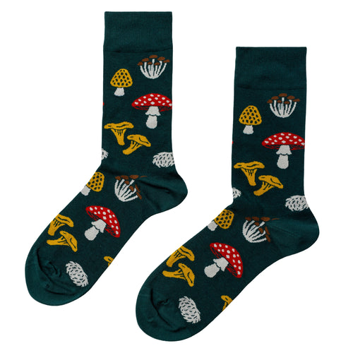 Dark green crew socks featuring illustrated forest mushrooms including amanita chanterelle and hen of the woods by Yellow Owl Workshop