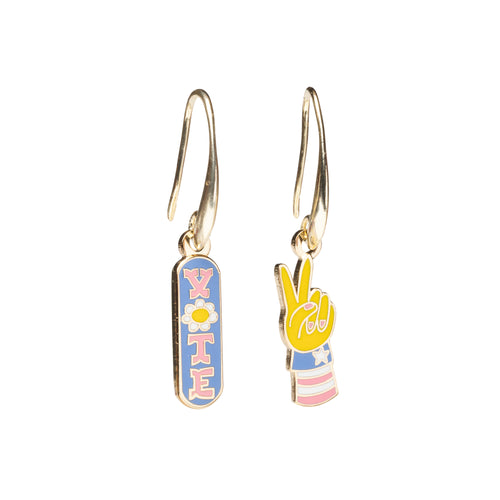 Mismatched enamel drop earrings featuring blue Vote badge with daisy and pink and blue peace sign hand by Yellow Owl Workshop