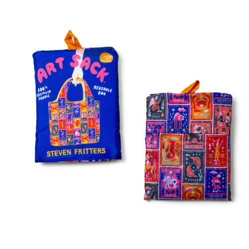 Alt: Zodiac Art Sack® folded front and back showing colorful astrology illustration and red Art Sack® packaging by Roisin O'Donnell for Yellow Owl Workshop
