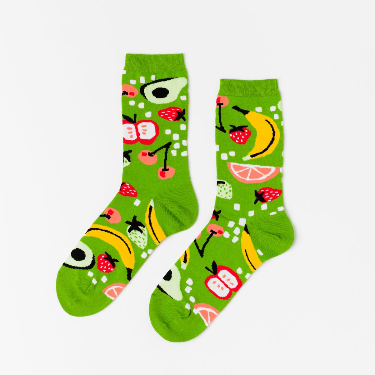 Bright green crew socks featuring illustrated avocado banana strawberry cherries apple and grapefruit by Yellow Owl Workshop
