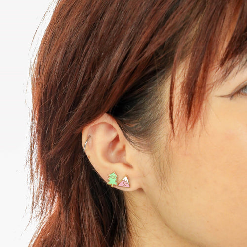 Mountain and tree mismatched cloisonné stud earrings worn on ear by Yellow Owl Workshop