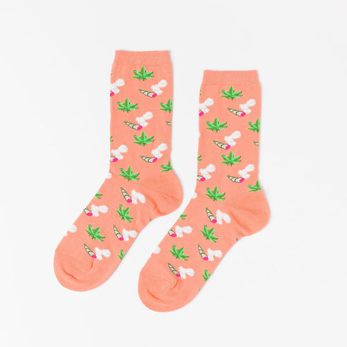 Peach crew socks featuring illustrated cannabis leaves lit joints and smoke clouds by Yellow Owl Workshop