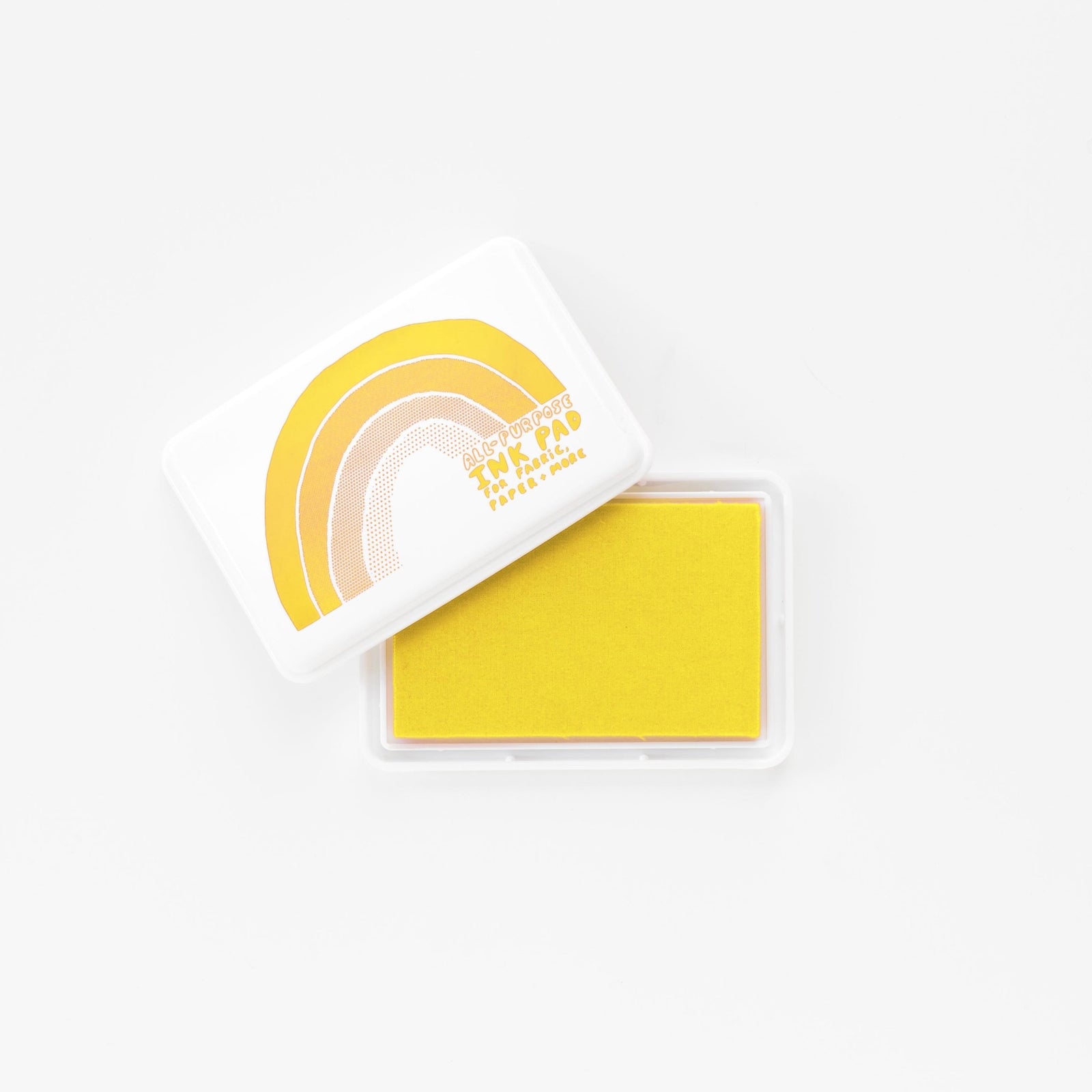 Yellow permanent waterproof all-purpose ink pad open showing yellow ink pad and white rainbow lid by Yellow Owl Workshop