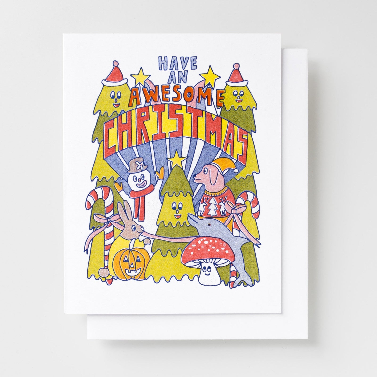 Risograph greeting card with illustrated Christmas trees wearing Santa hats, a snowman, rabbit, dolphin in a sweater, mushroom, and jack-o-lantern, text reads Have an Awesome Christmas in bold red and blue lettering