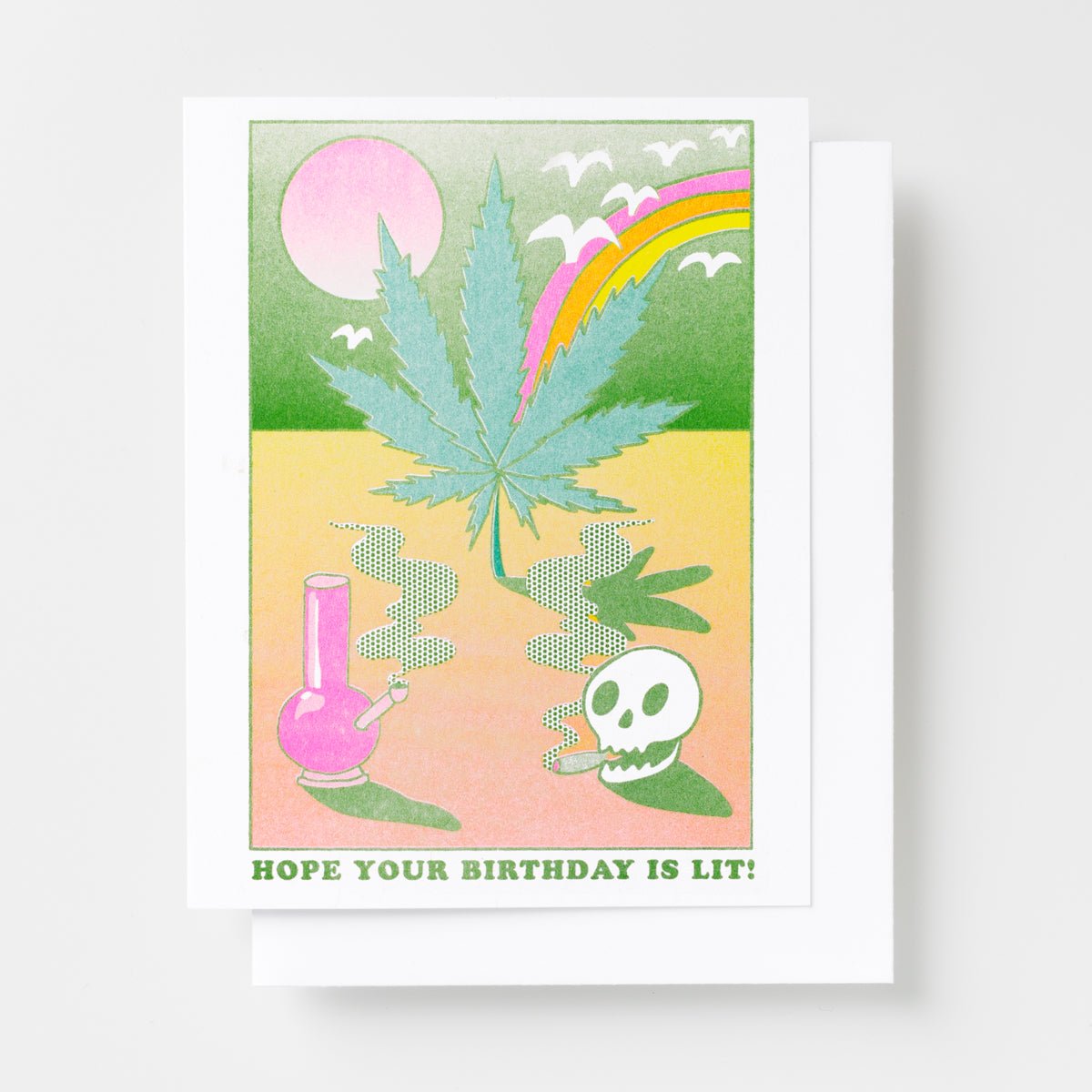 Risograph greeting card with a retro psychedelic scene featuring a cannabis leaf, pink bong, skull, rainbow, and birds, text reads Hope Your Birthday Is Lit in bold green lettering
